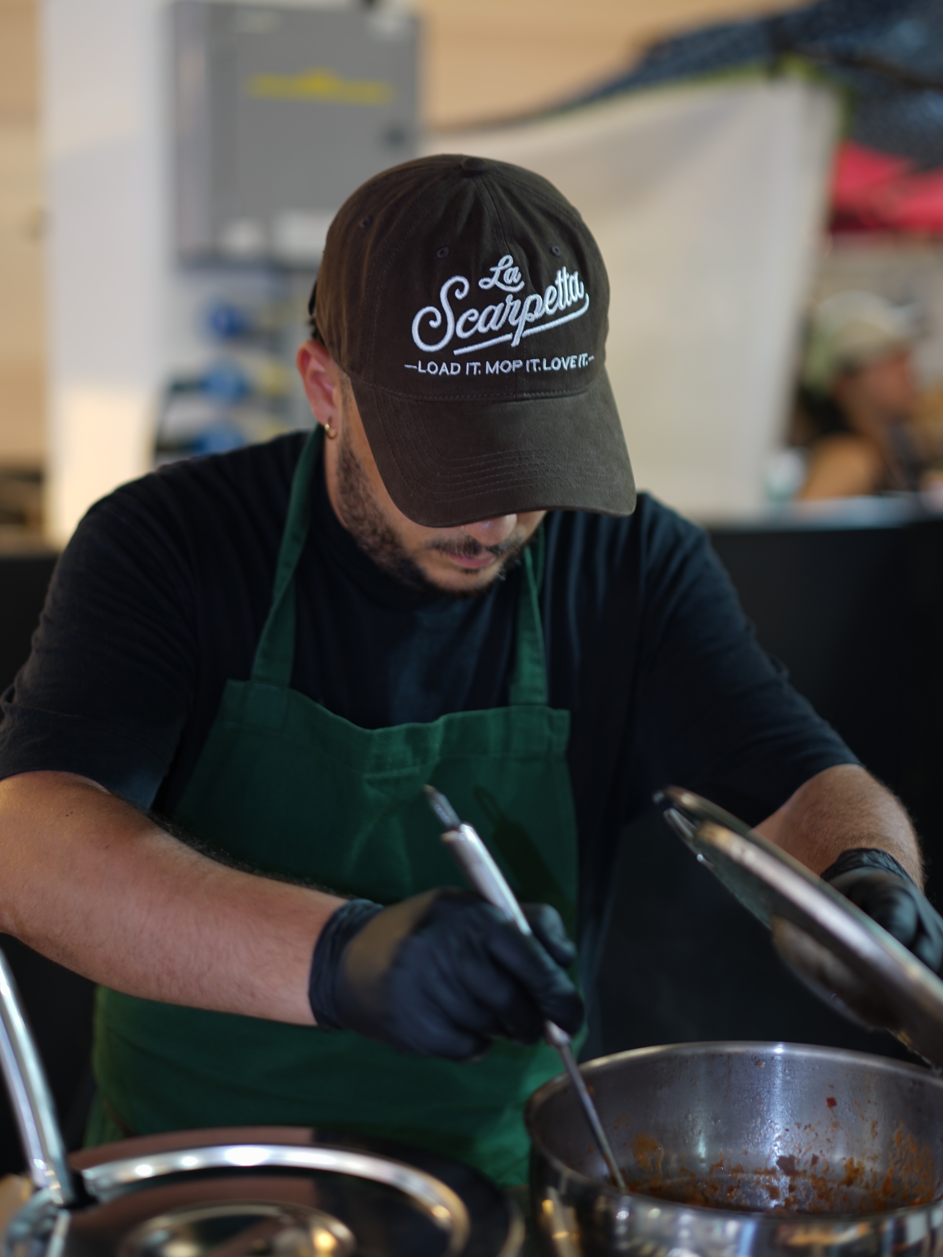 Chef preparing fresh sauce pots